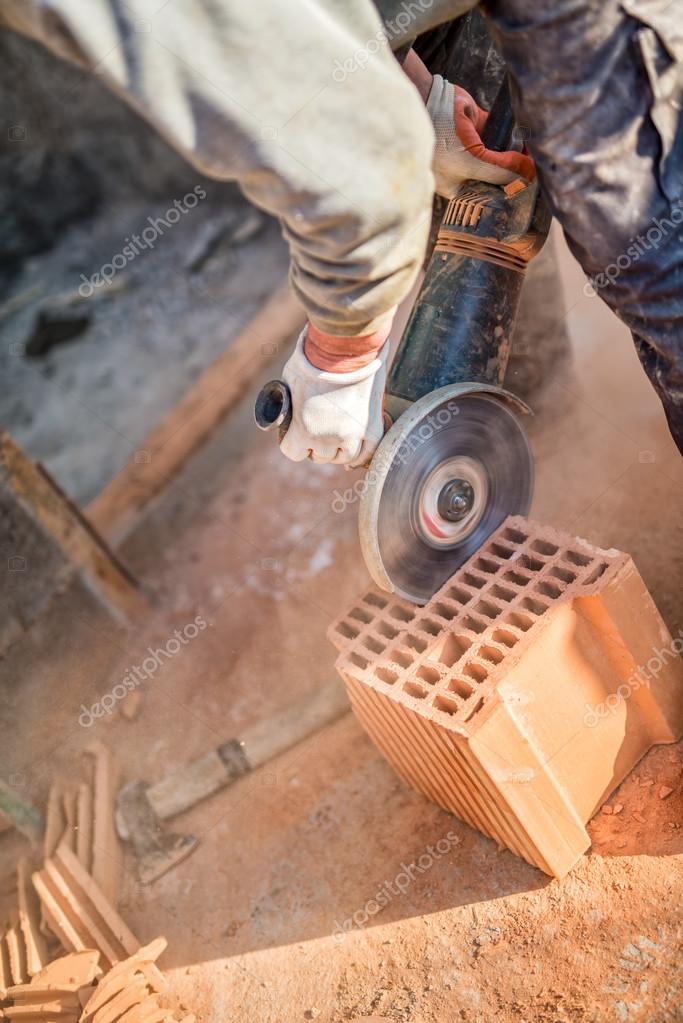 https://st2.depositphotos.com/1387241/6540/i/950/depositphotos_65402447-stock-photo-male-worker-cutting-bricks-with.jpg
